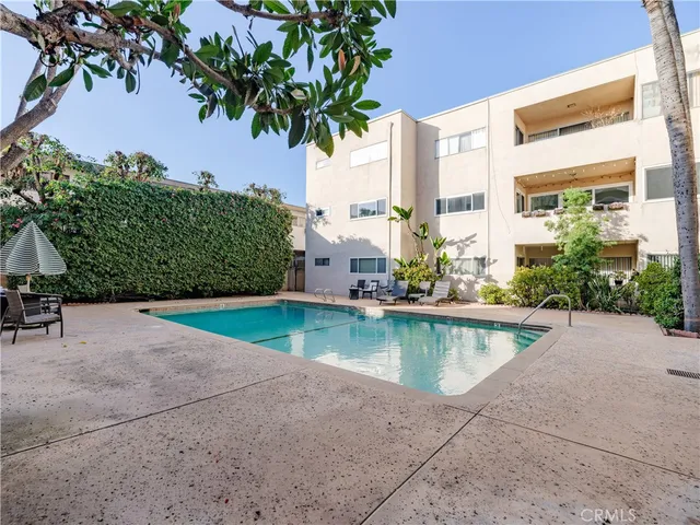 a view of a swimming pool with a patio