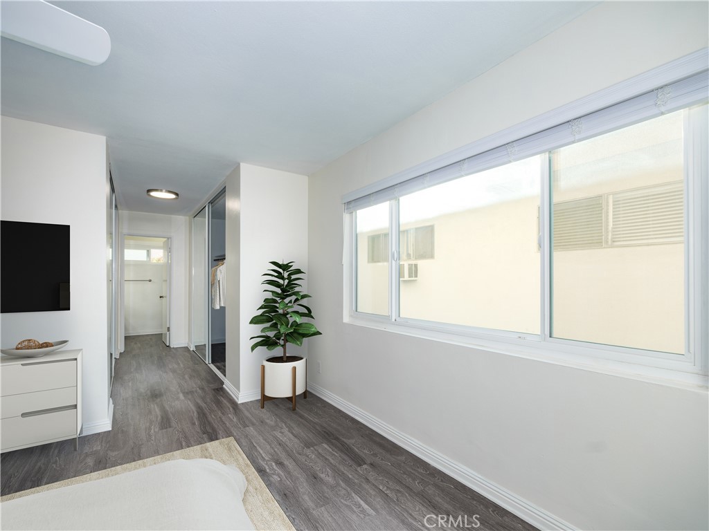 5411 Tyrone Avenue Sherman Oaks, CA 91401 - Photo 21 of 28 a view of an empty room with a window and wooden floor