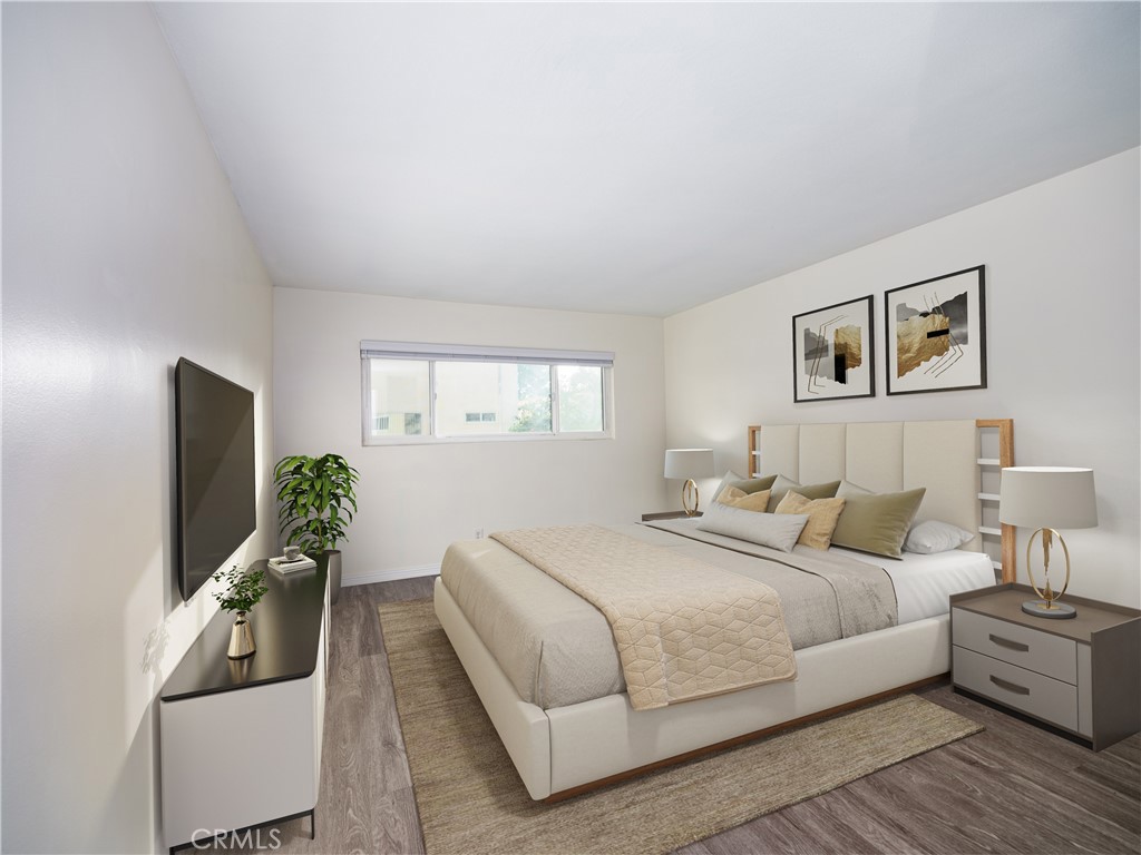 5411 Tyrone Avenue Sherman Oaks, CA 91401 - Photo 23 of 28 a bedroom with a large bed and a flat screen tv