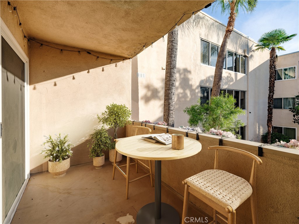5411 Tyrone Avenue Sherman Oaks, CA 91401 - Photo 24 of 28 a outdoor dining space with furniture and a potted plant