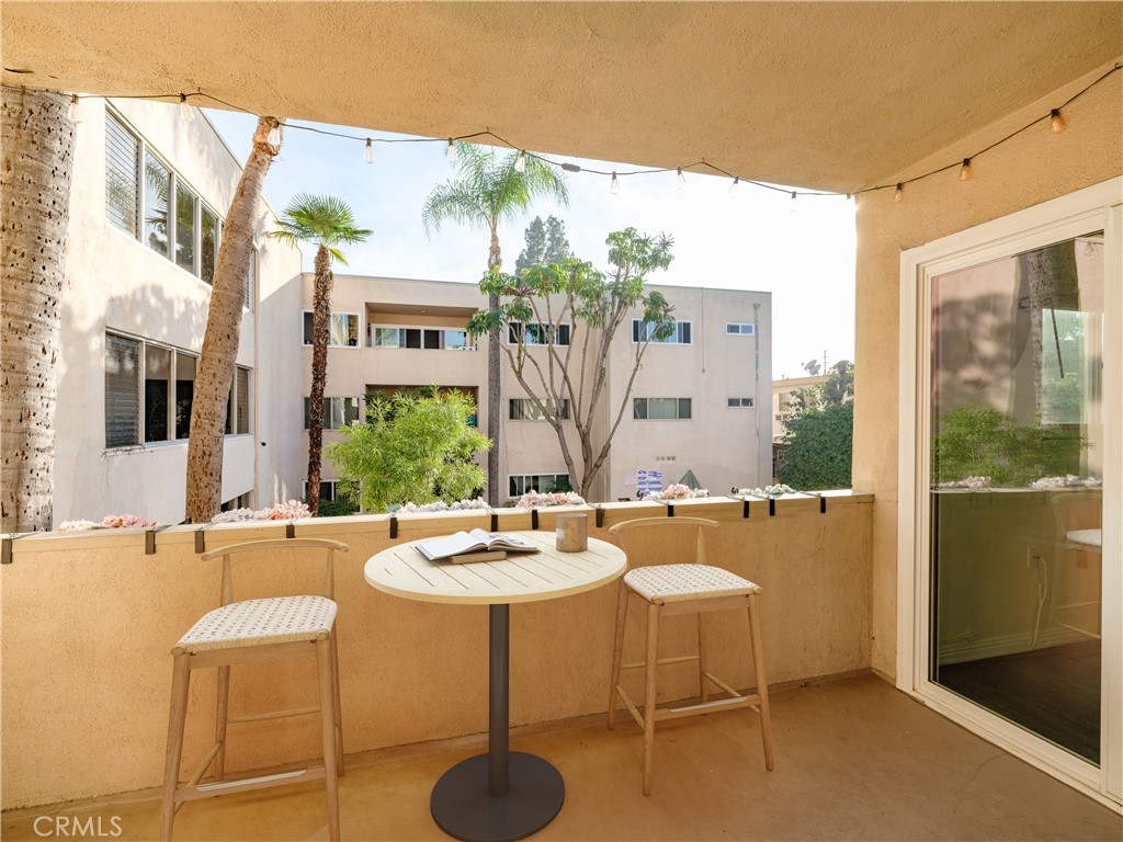 5411 Tyrone Avenue Sherman Oaks, CA 91401 - Photo 26 of 28 a dining room with chairs and a table