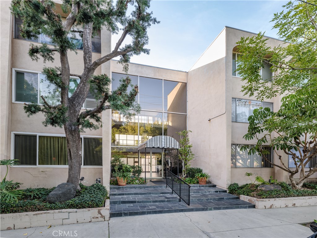 5411 Tyrone Avenue Sherman Oaks, CA 91401 - Photo 27 of 28 a front view of a house with tree s