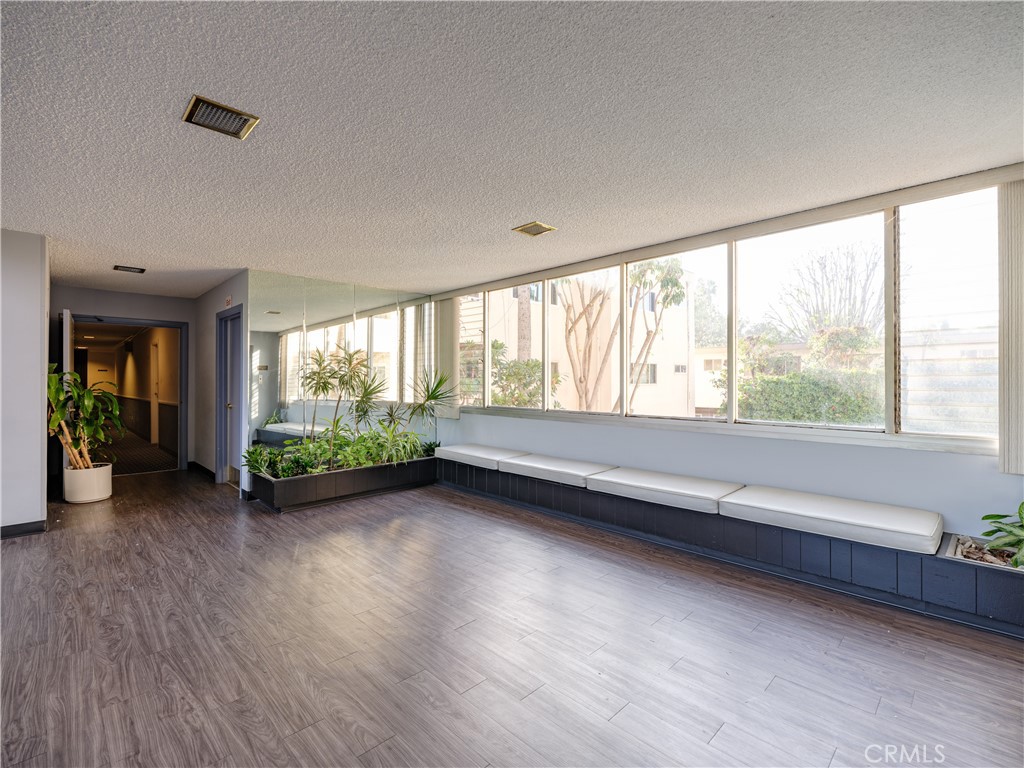 5411 Tyrone Avenue Sherman Oaks, CA 91401 - Photo 3 of 28 a view of room with window and hardwood floor
