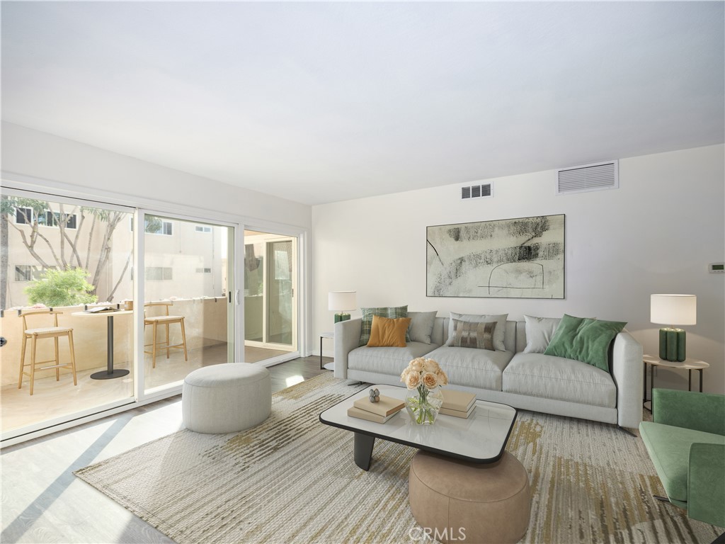 5411 Tyrone Avenue Sherman Oaks, CA 91401 - Photo 9 of 28 a living room with furniture and a large window