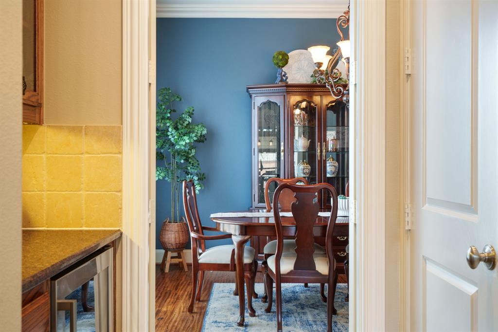 9144 Calvert Road Lantana, TX 76226 - Photo 11 of 40 a view of a dining room with furniture and chandelier