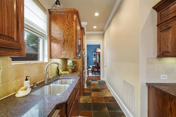 a bathroom with sink and mirror