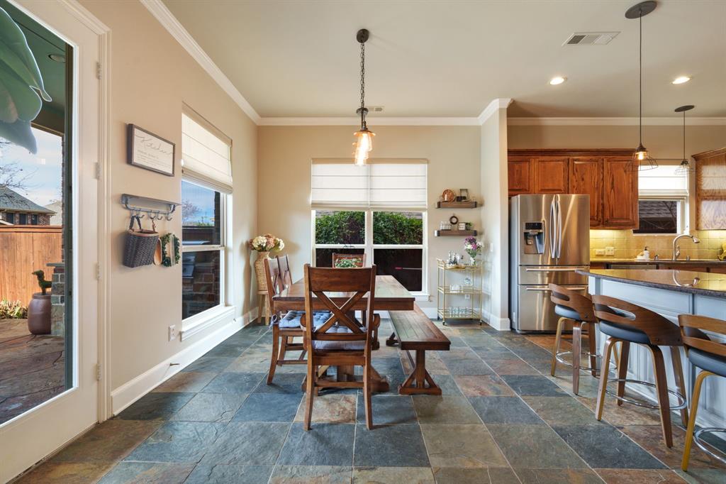 9144 Calvert Road Lantana, TX 76226 - Photo 16 of 40 a view of a dining room with furniture window and wooden floor