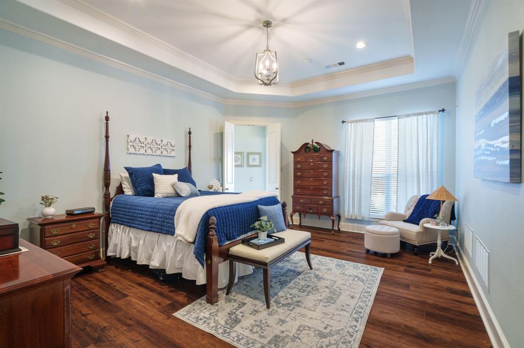 9144 Calvert Road Lantana, TX 76226 - Photo 19 of 40 a bedroom with furniture and a rug