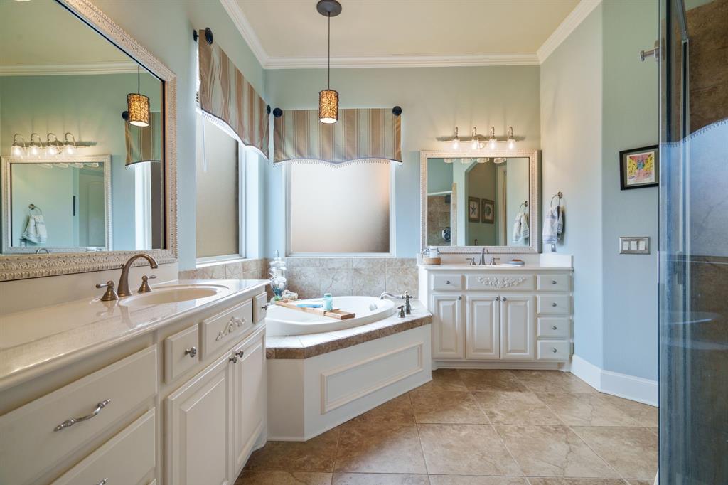 9144 Calvert Road Lantana, TX 76226 - Photo 20 of 40 a bathroom with a granite countertop sink mirror and double