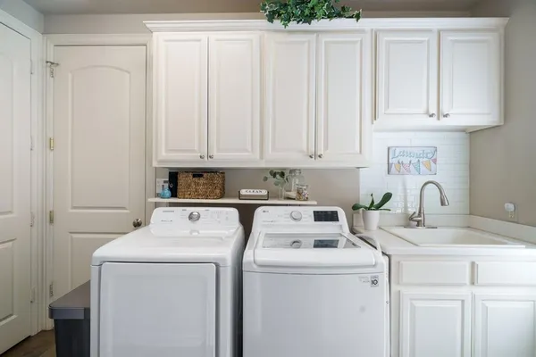 a view of storage and utility room with washer and dryer