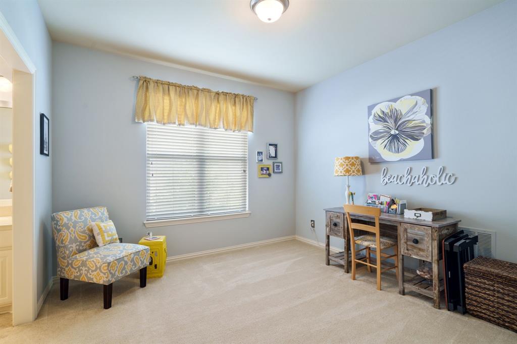 9144 Calvert Road Lantana, TX 76226 - Photo 22 of 40 a bedroom with furniture and a window