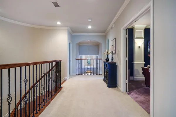 a view of a hallway with a living room