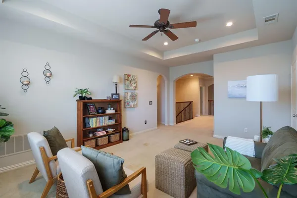 a view of a livingroom with furniture and a wooden floor