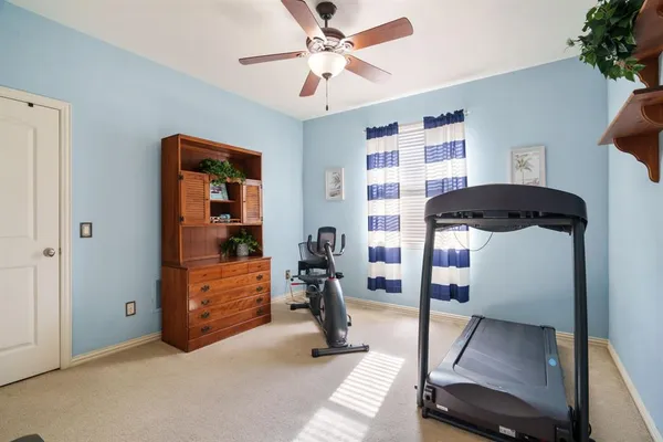 a view of living room with furniture and a chandelier