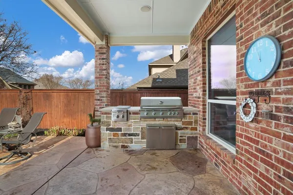 a room with furniture a mirror and a fireplace