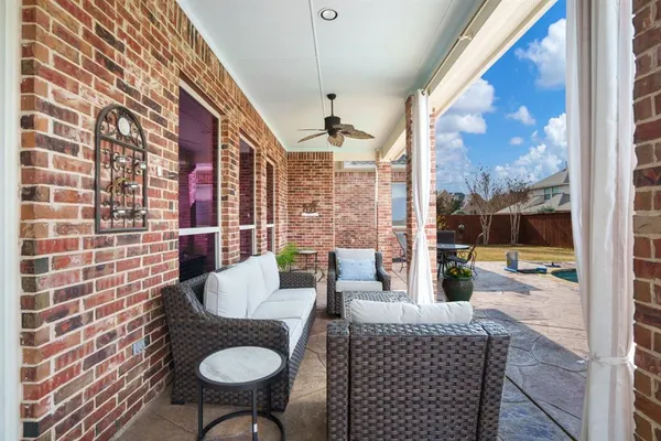 a view of a dining room with furniture wooden floor and a chandelier