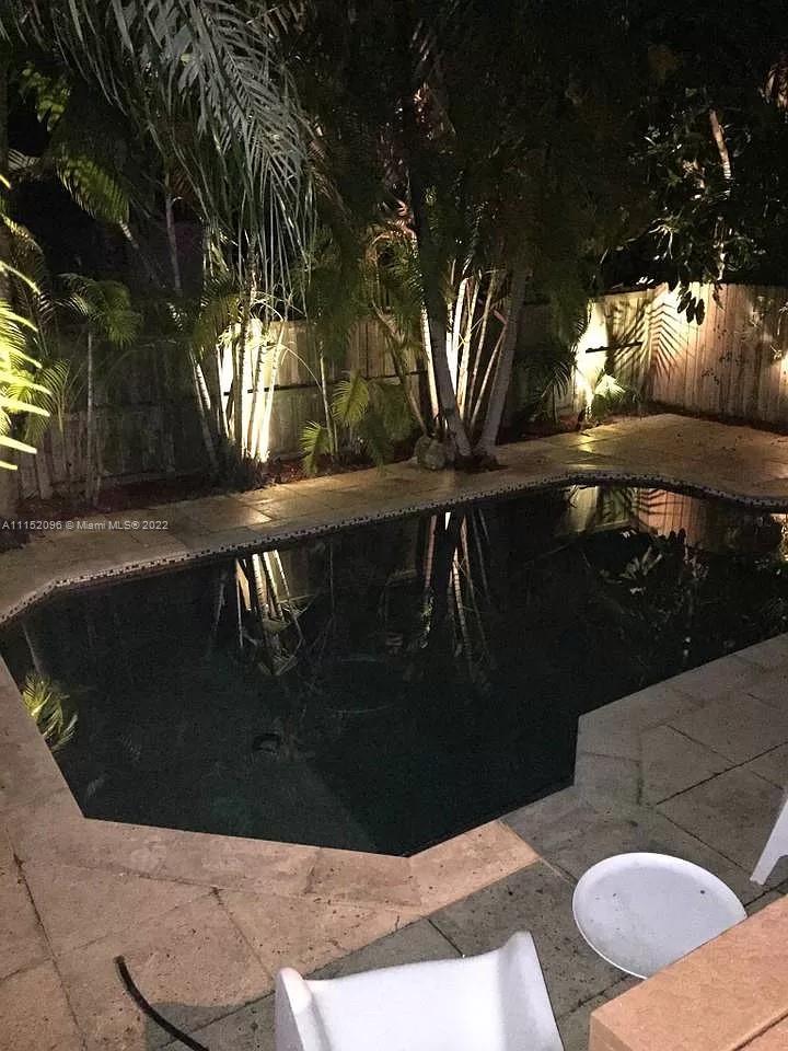 272 Fernwood Road Key Biscayne, FL 33149 - Photo 18 of 30 a view of swimming pool with seating space