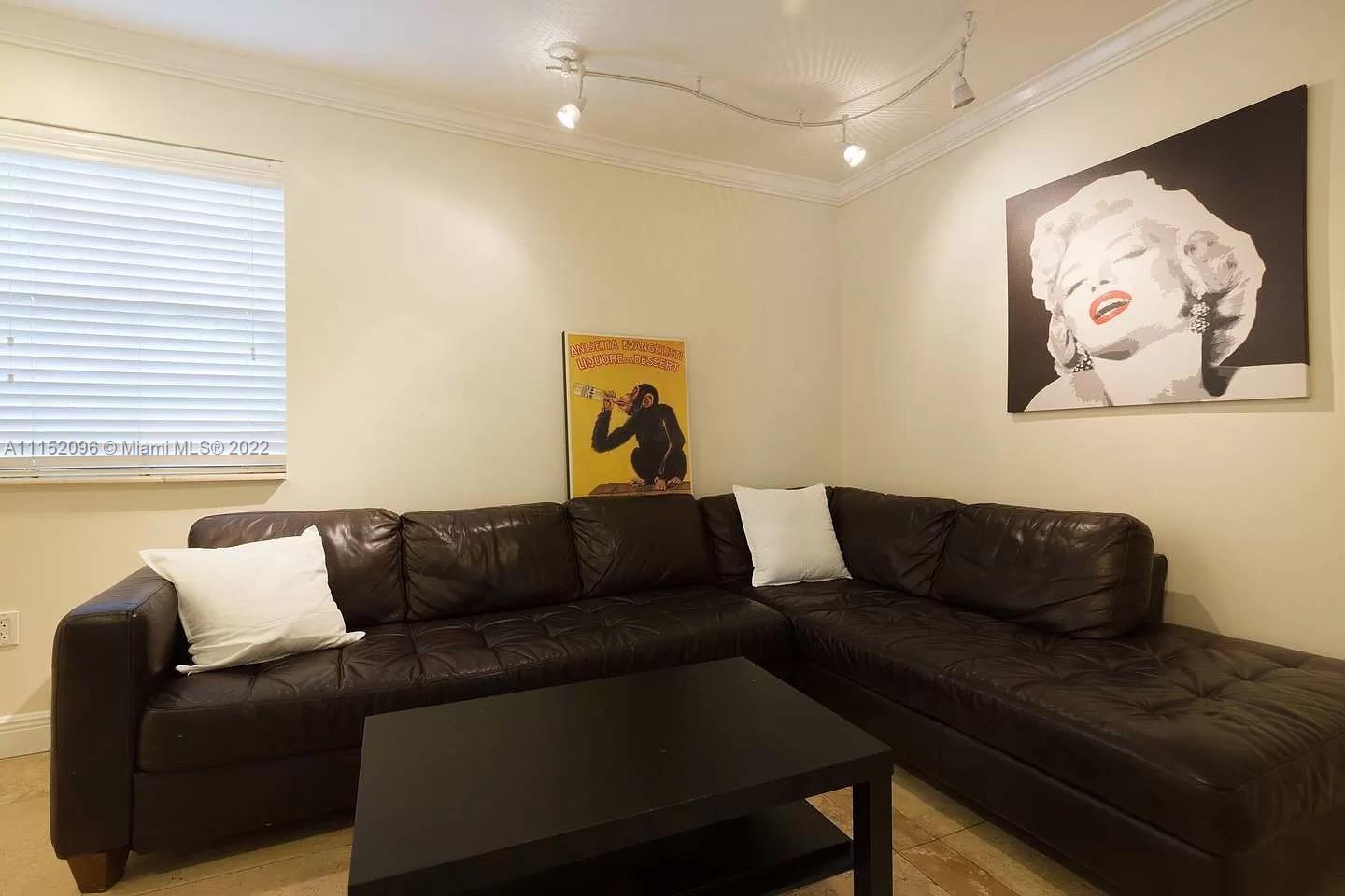 272 Fernwood Road Key Biscayne, FL 33149 - Photo 21 of 30 a living room with furniture and a couch