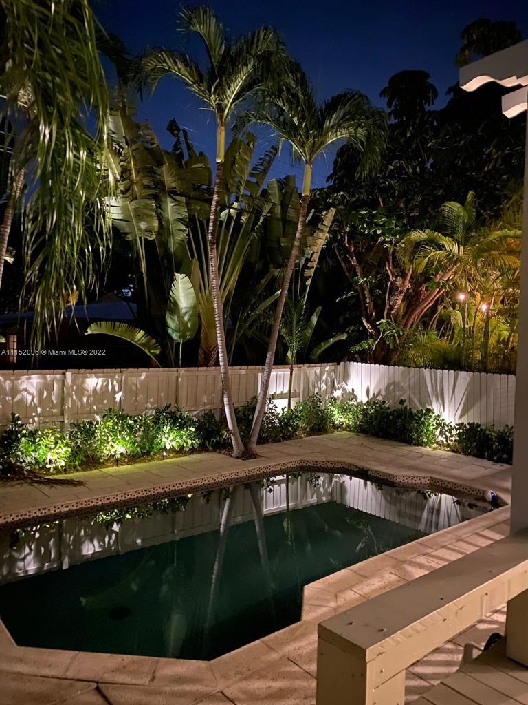 272 Fernwood Road Key Biscayne, FL 33149 - Photo 27 of 30 a view of a swimming pool with a patio