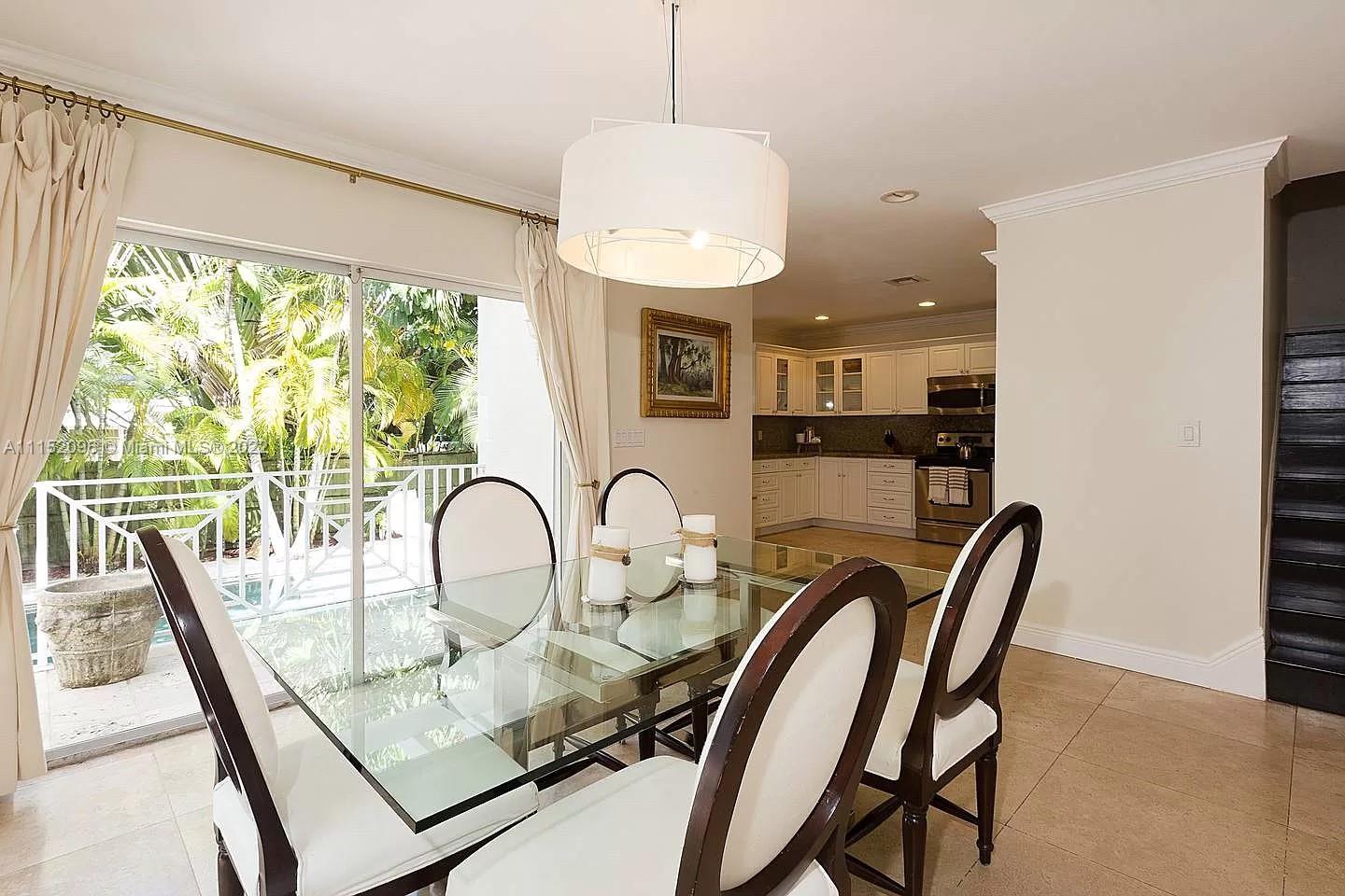 272 Fernwood Road Key Biscayne, FL 33149 - Photo 5 of 30 a dining room with furniture and a window