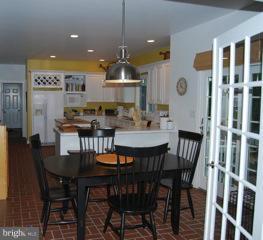 525 Howard Farm Road Shepherdstown, WV 25443 - Photo 4 of 19 a view of a dining room with furniture and wooden floor