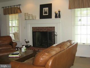 525 Howard Farm Road Shepherdstown, WV 25443 - Photo 7 of 19 a living room with furniture and a fireplace
