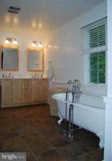525 Howard Farm Road Shepherdstown, WV 25443 - Photo 10 of 19 a kitchen with kitchen island a counter top space a sink and appliances