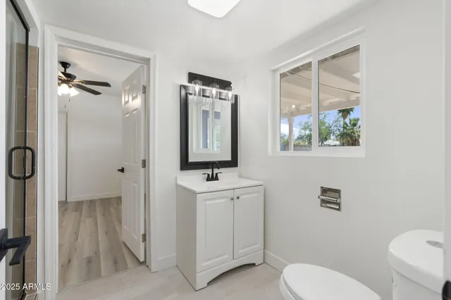 a bathroom with a shower and a sink