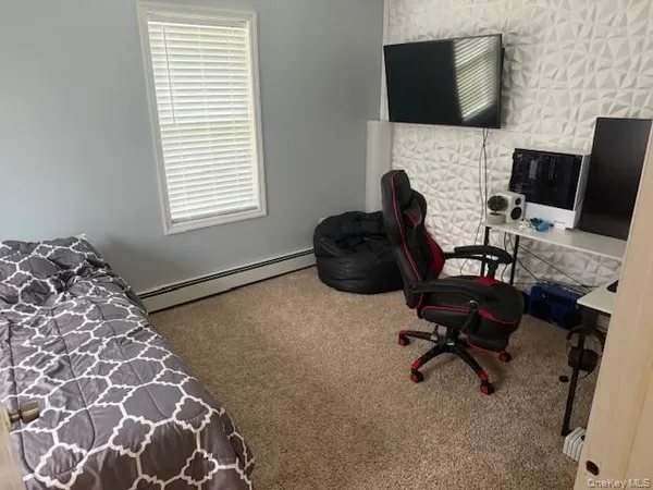 a livingroom with a workspace