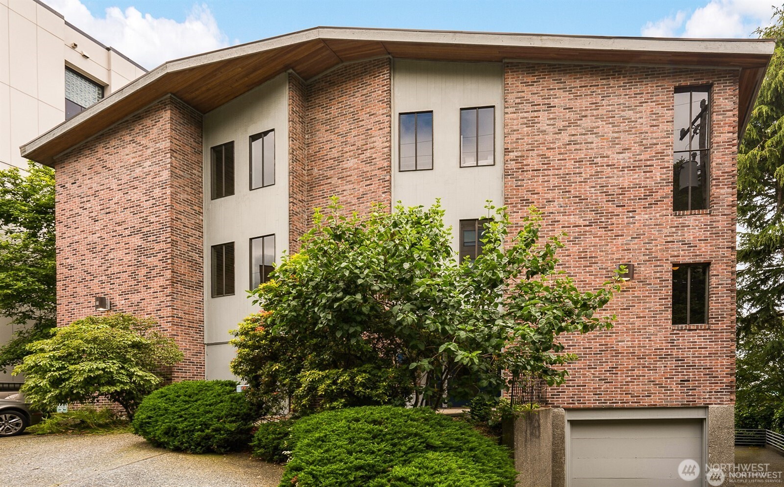 617 West Mercer Place, Unit 401 Seattle, WA 98119 - Photo 15 of 15 a front view of a house with plants