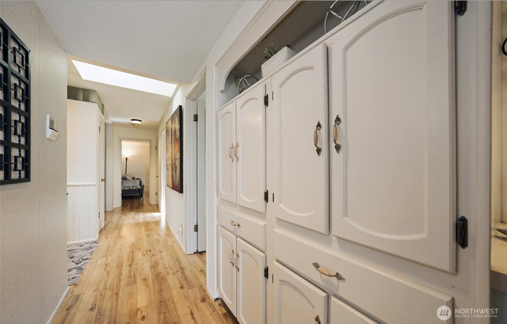 617 West Mercer Place, Unit 401 Seattle, WA 98119 - Photo 4 of 15 a view of a hallway with wooden floor and staircase