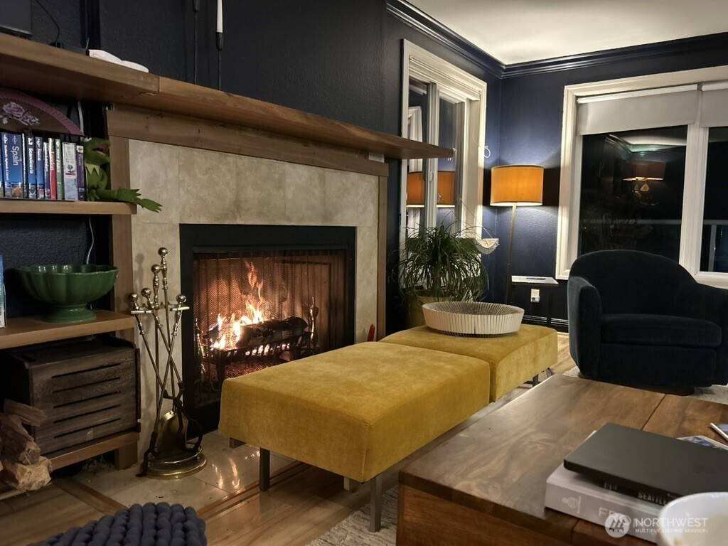 617 West Mercer Place, Unit 401 Seattle, WA 98119 - Photo 5 of 15 a living room with furniture and a fireplace