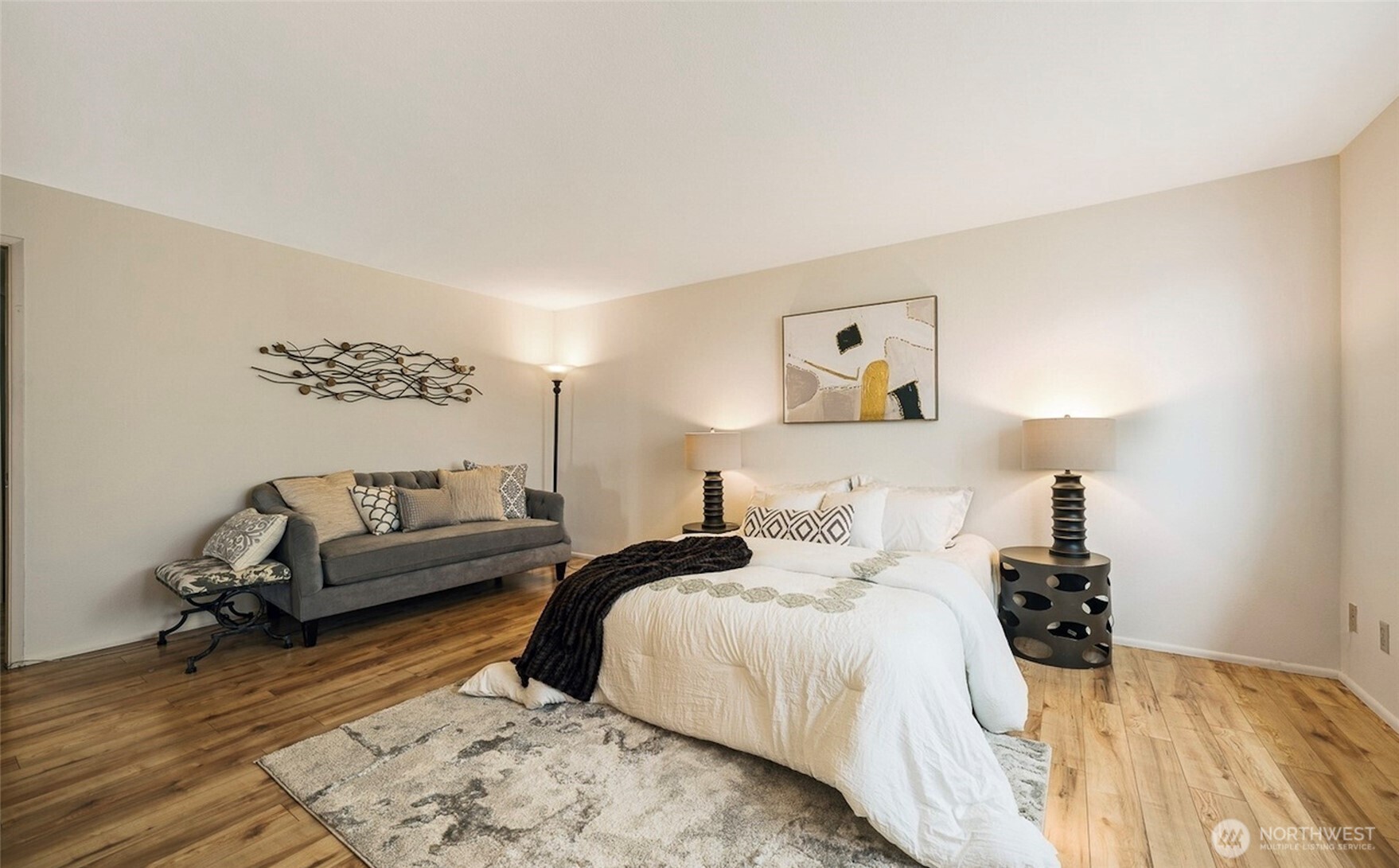 617 West Mercer Place, Unit 401 Seattle, WA 98119 - Photo 8 of 15 a bedroom with a bed and a couch