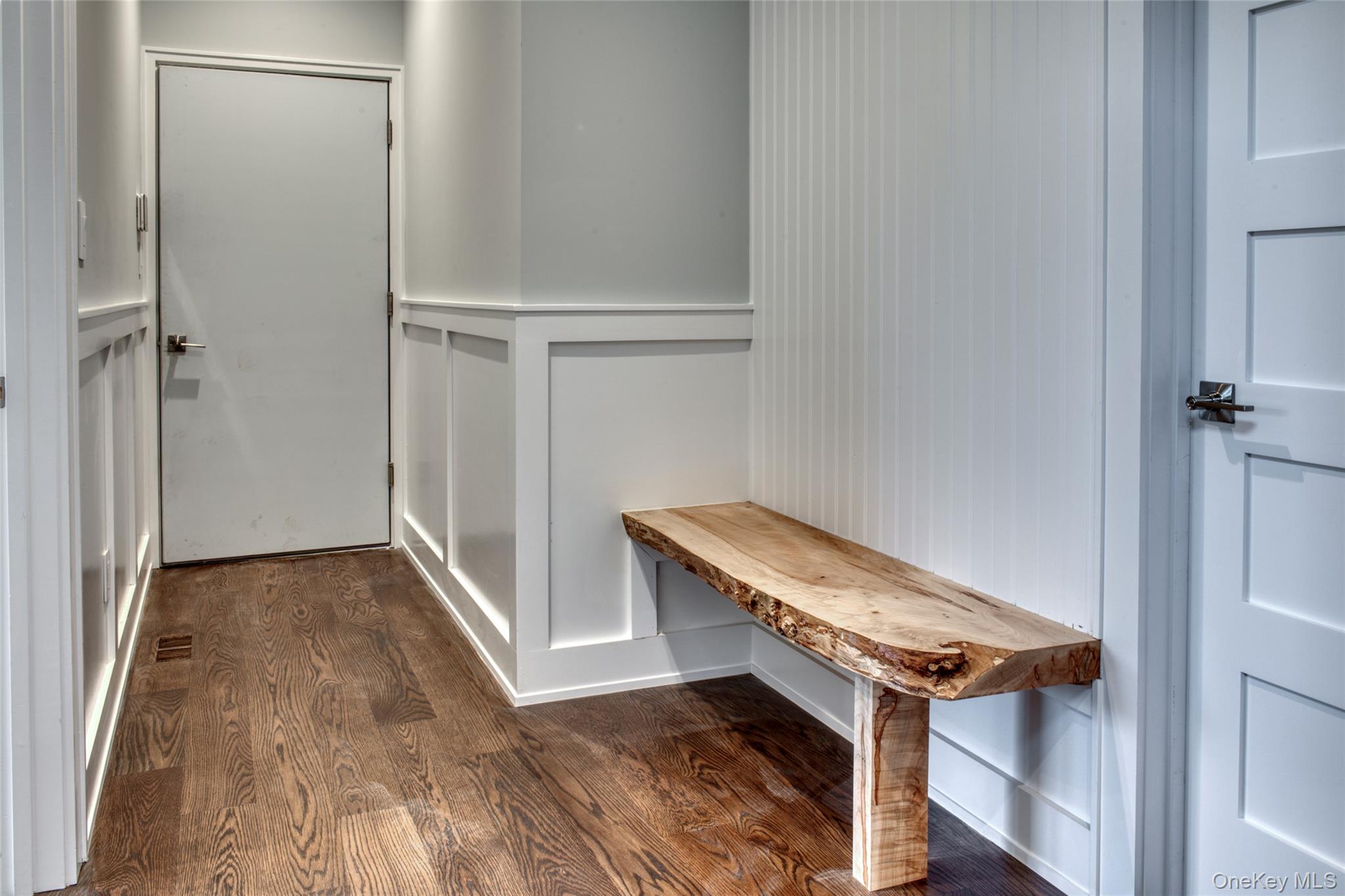 435 Maple Lane Greenport, NY 11944 - Photo 17 of 44 a view of a hallway with wooden floor