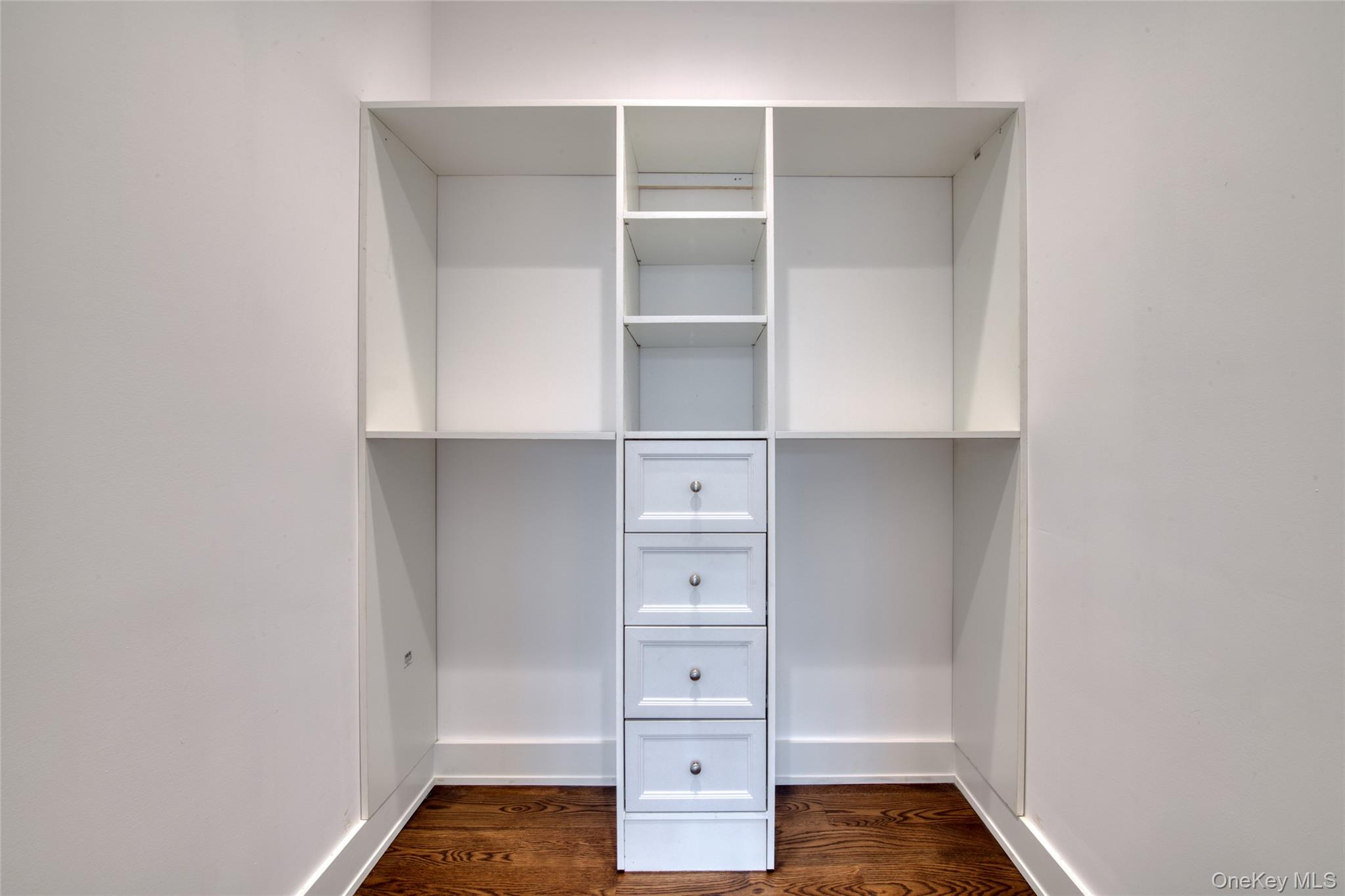 435 Maple Lane Greenport, NY 11944 - Photo 26 of 44 a view of walk in closet with empty racks