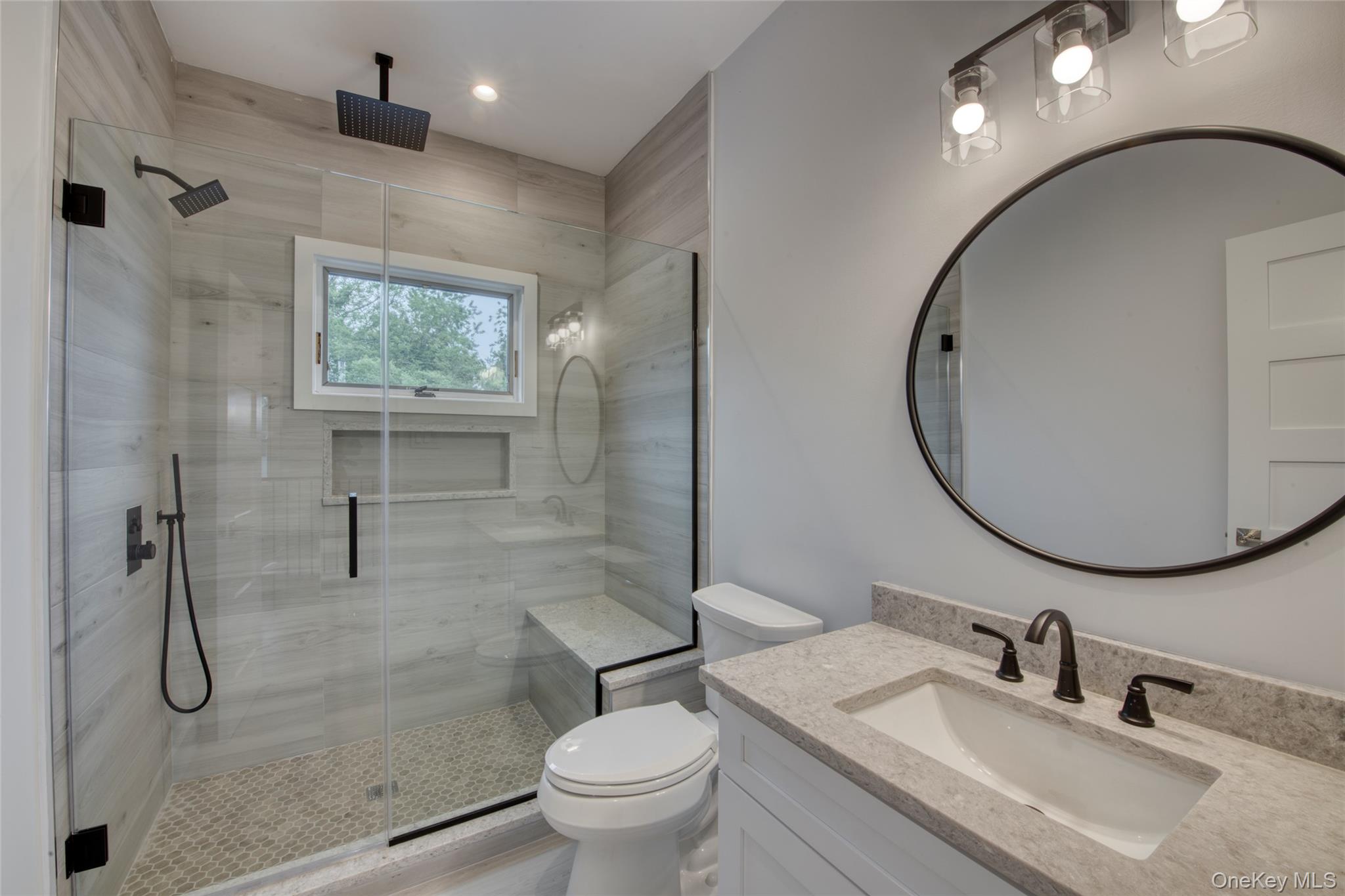435 Maple Lane Greenport, NY 11944 - Photo 34 of 44 a bathroom with a sink toilet and shower