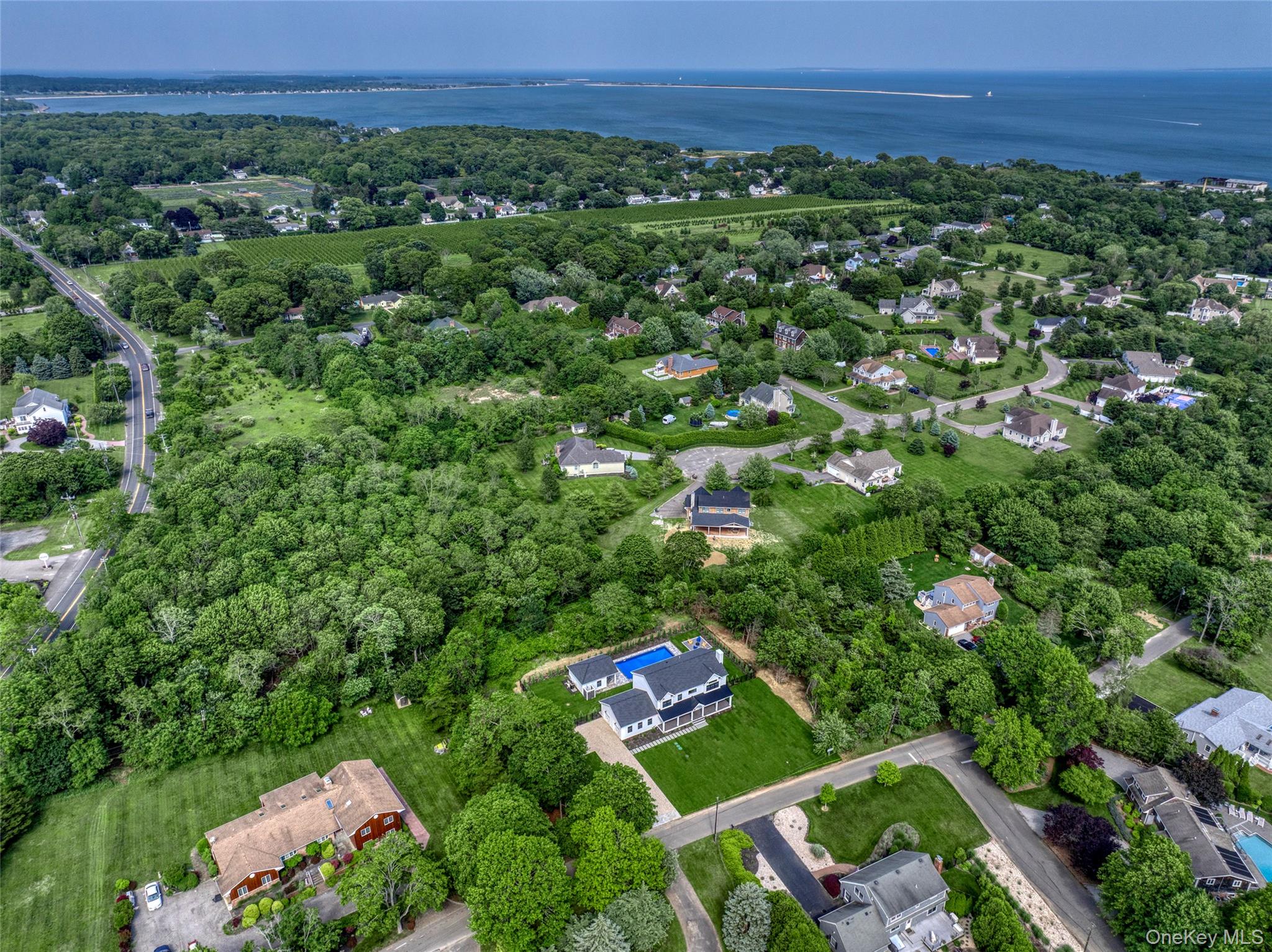 435 Maple Lane Greenport, NY 11944 - Photo 42 of 42 View of property location with a large body of water and nearby suburban area