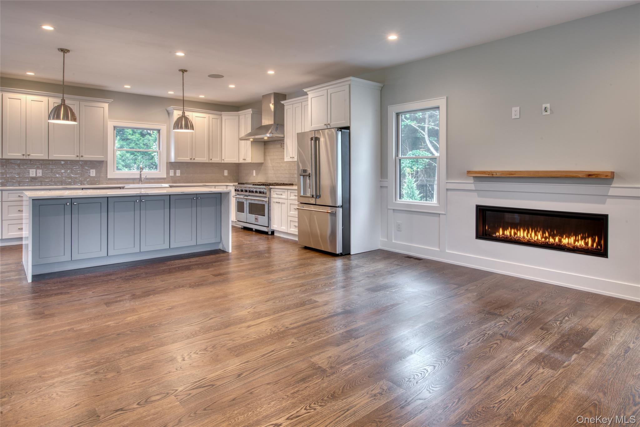 435 Maple Lane Greenport, NY 11944 - Photo 9 of 44 a open kitchen with kitchen island wooden floors appliances and cabinets