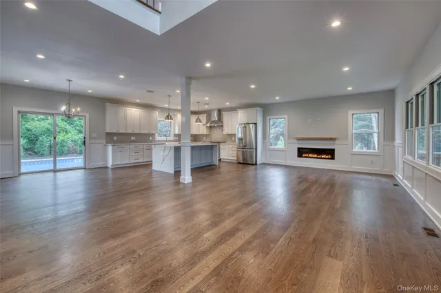 a view of kitchen with cabinets and wooden floor