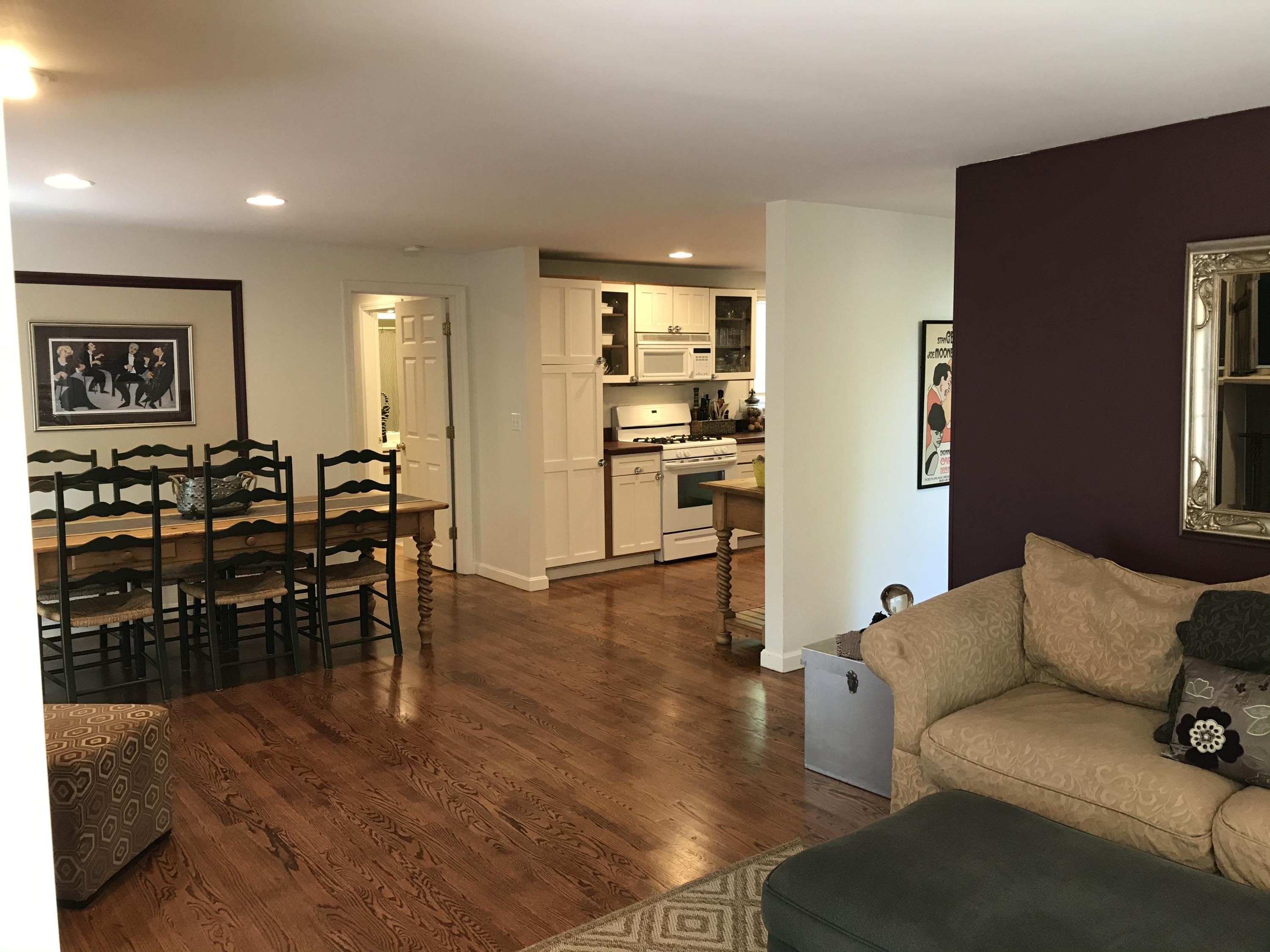 5 Wood Road Mashpee, MA 02649 - Photo 5 of 53 a living room with furniture kitchen view and a wooden floor