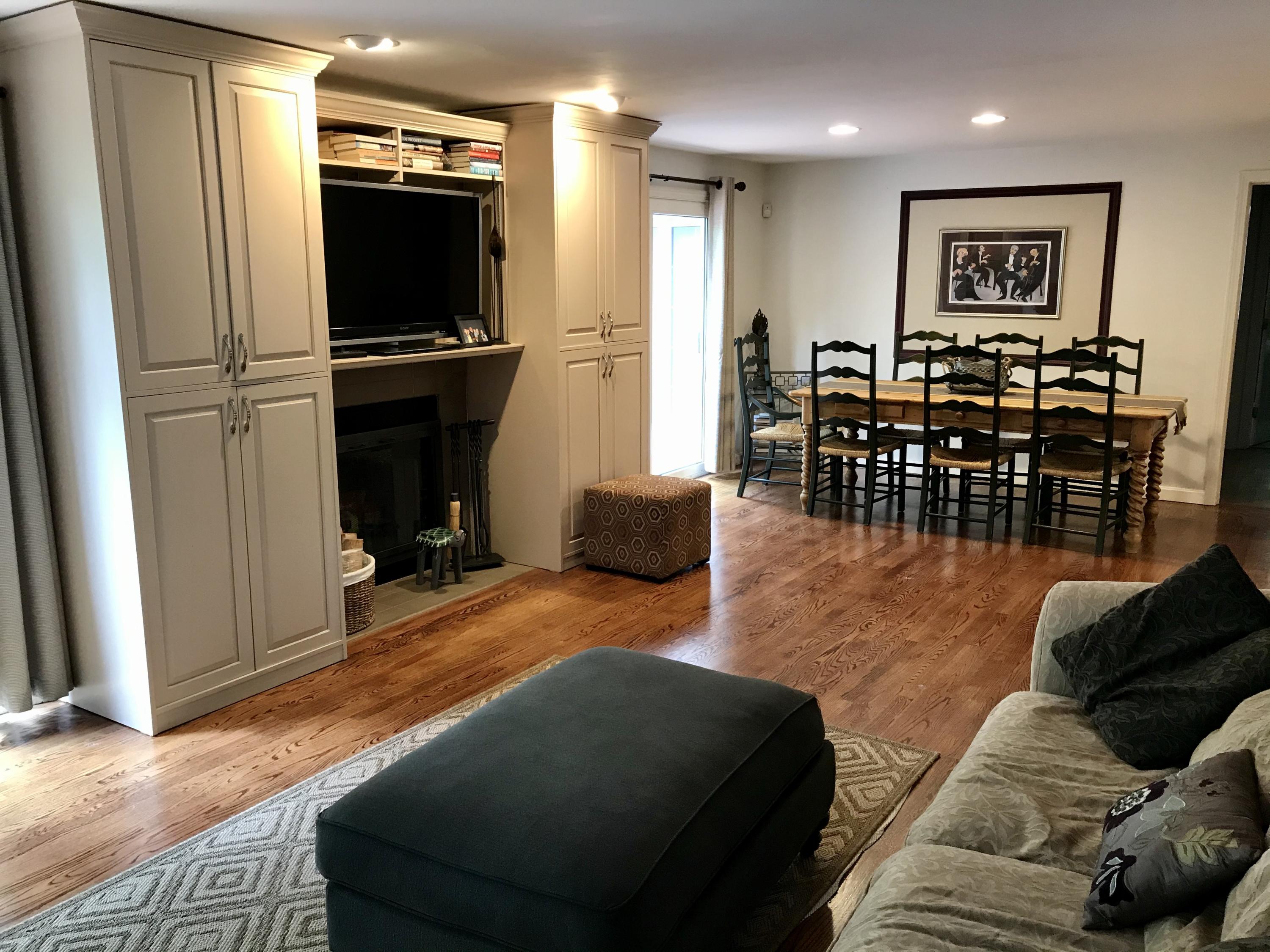 5 Wood Road Mashpee, MA 02649 - Photo 9 of 53 a living room with furniture and a flat screen tv
