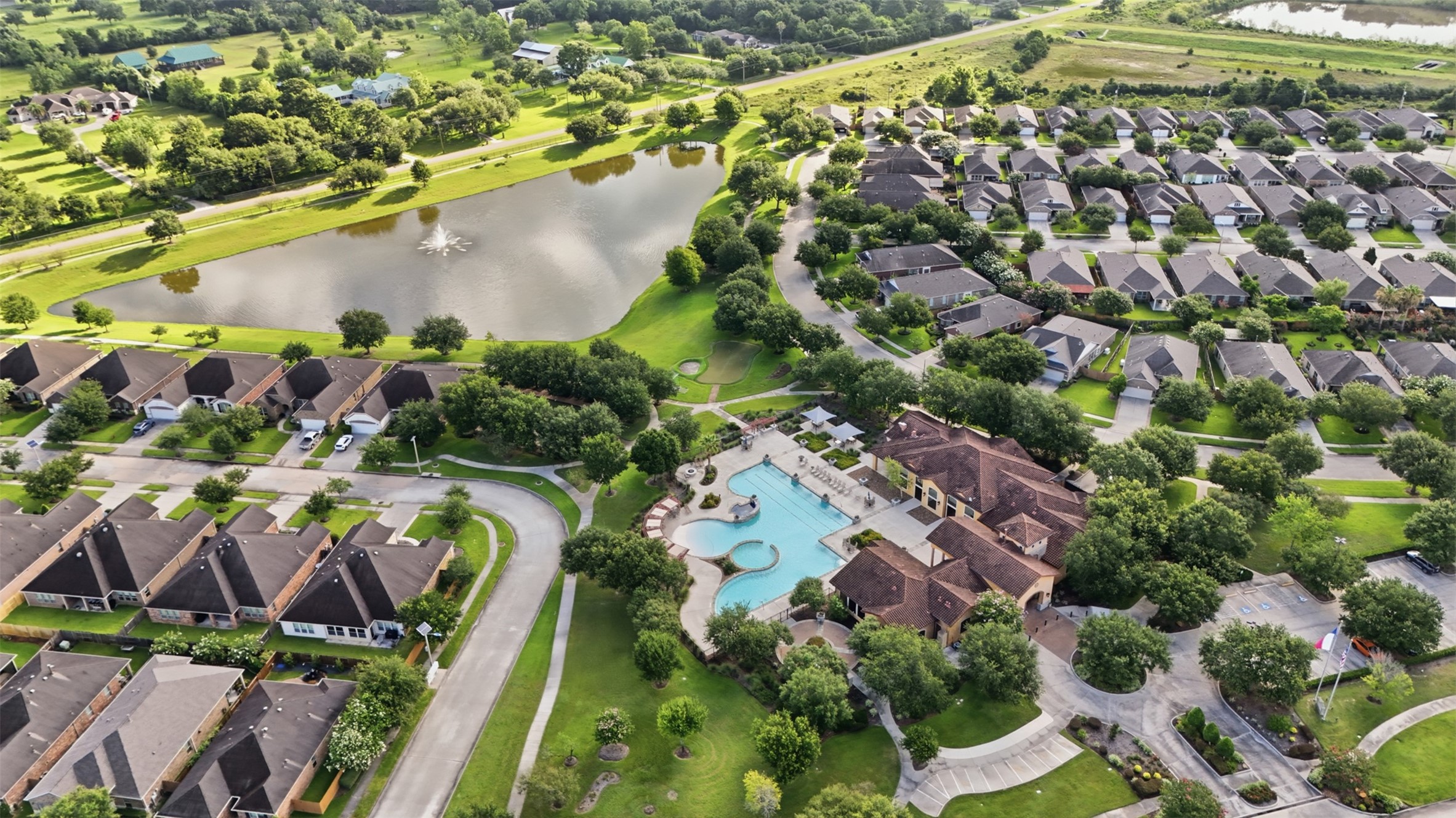 721 Rufina Street League City, TX 77573 - Photo 24 of 33 Residents enjoy exceptional resort-style amenities just moments from home. The beautifully landscaped recreation center features a sparkling resort-style pool, spa, fitness center, clubhouse, & scenic walking paths alongside the lake.