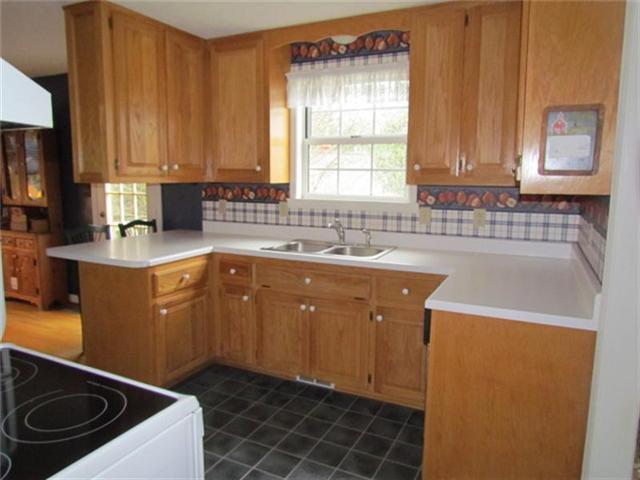 4016 New Chapel Road Springfield, TN 37172 - Photo 3 of 20 a kitchen with a sink a stove and cabinets