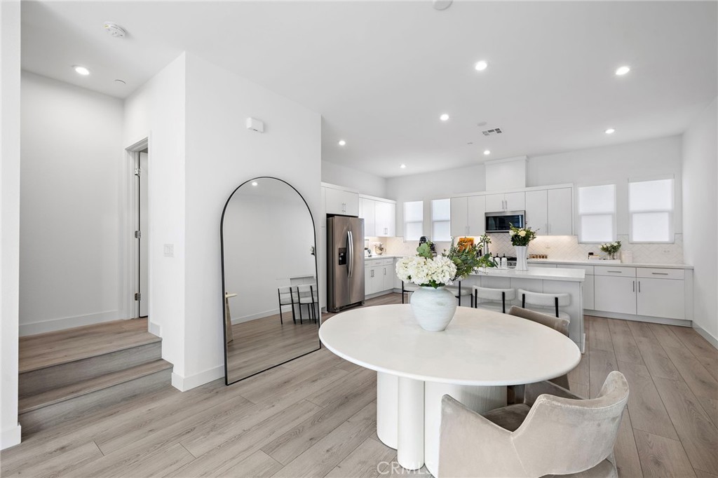 1826 West Bushell Street Anaheim, CA 92805 - Photo 10 of 30 a kitchen with a table and chairs in it