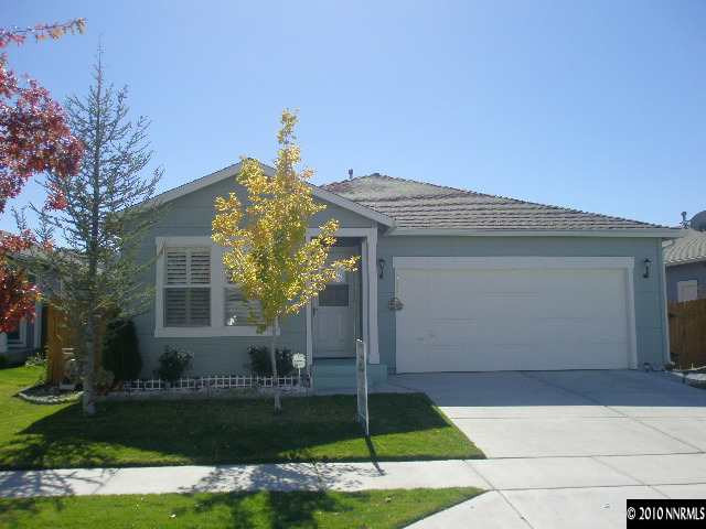 7680 Appenzell Street Reno, NV 89506 - Photo 1 of 10 a front view of a house with a garden and plants