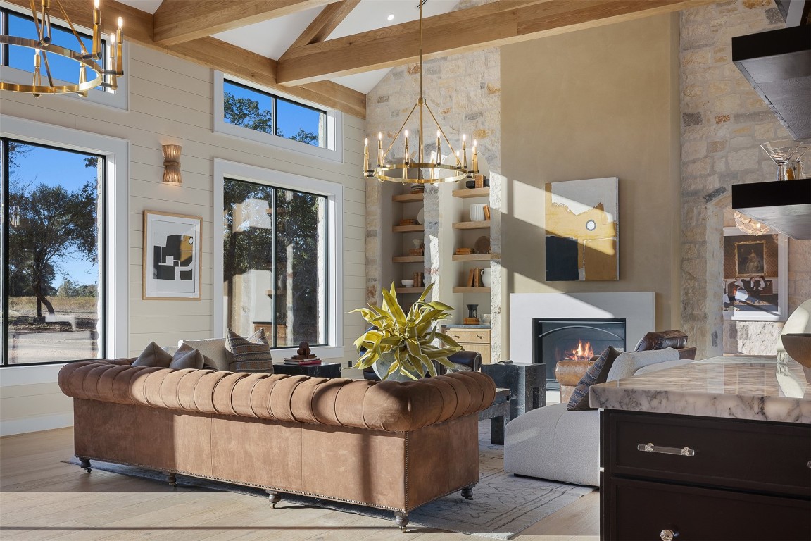 226 Hackemack Road Round Top, TX 78954 - Photo 17 of 50 a living room with furniture a fireplace and a flat screen tv