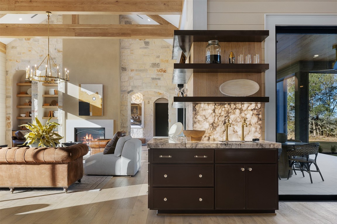 226 Hackemack Road Round Top, TX 78954 - Photo 18 of 50 a living room with furniture a fireplace and a large window