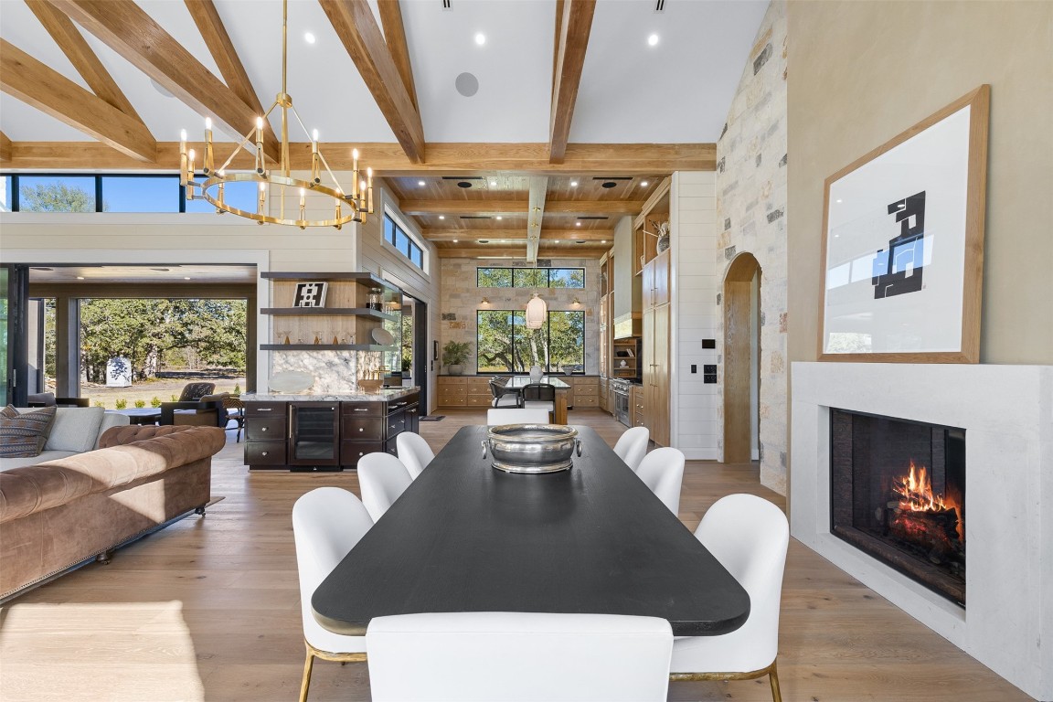 226 Hackemack Road Round Top, TX 78954 - Photo 20 of 50 a dining room with furniture a fireplace and wooden floor