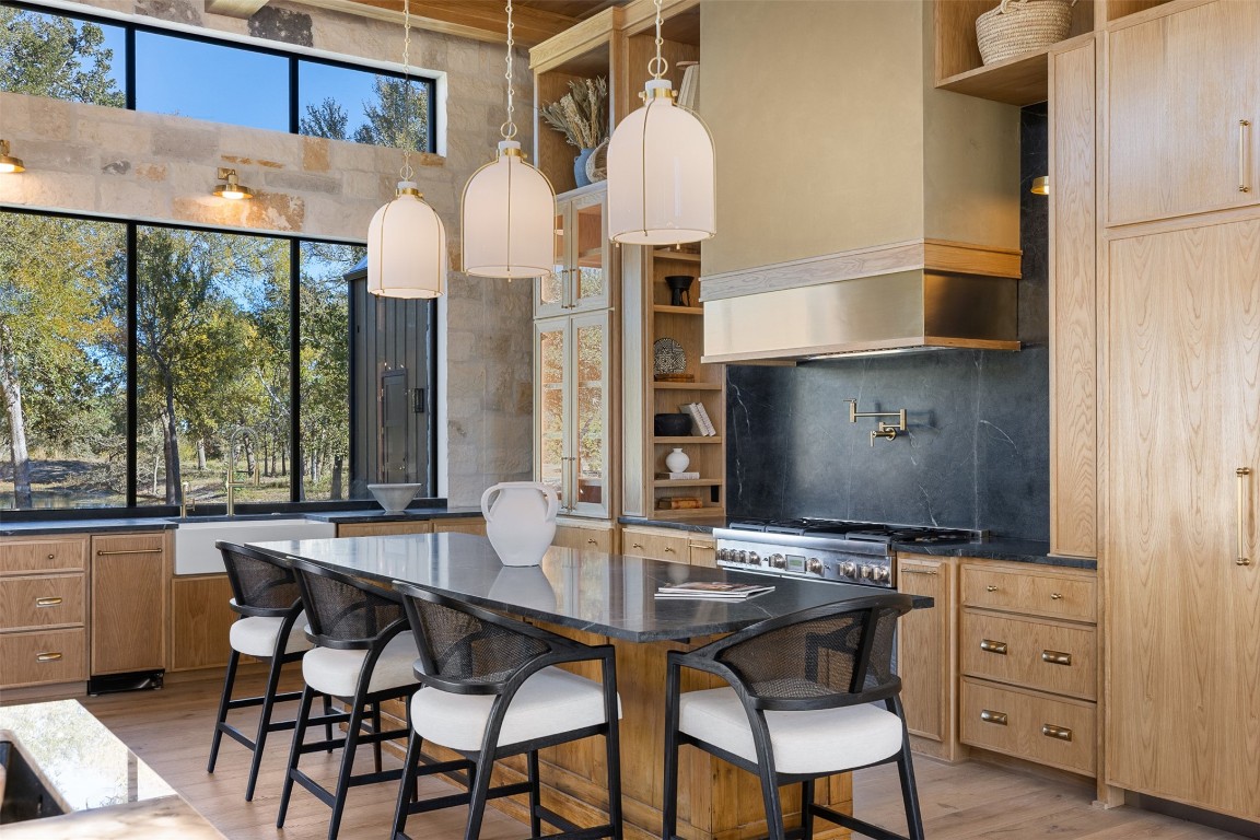 226 Hackemack Road Round Top, TX 78954 - Photo 21 of 50 a view of a dining room with furniture and chandelier