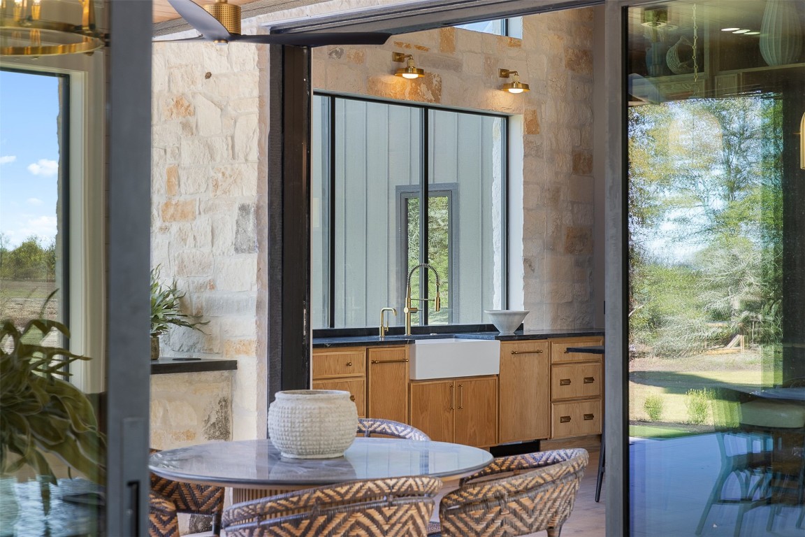 226 Hackemack Road Round Top, TX 78954 - Photo 22 of 50 view of living room with furniture and floor to ceiling window